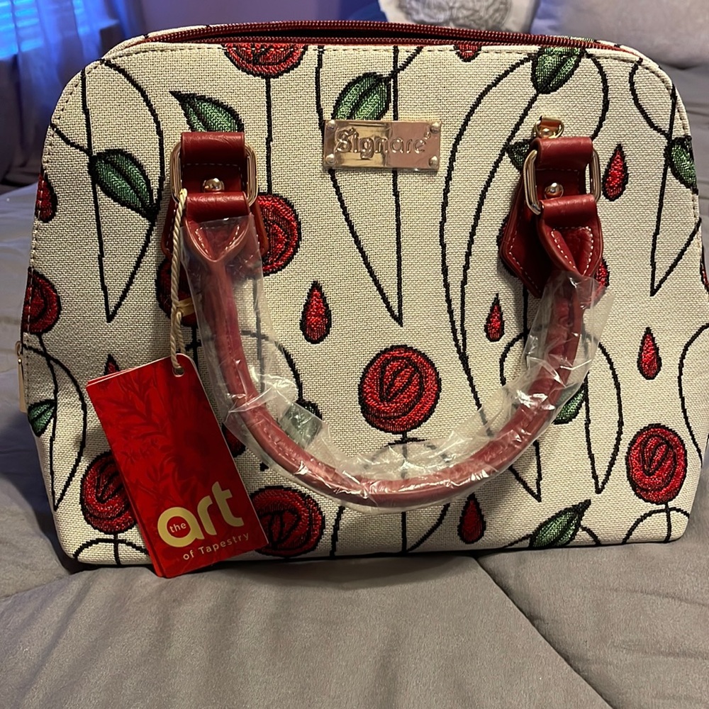 Convertible handbag with top handles or shoulder strap and feet on the bottom.